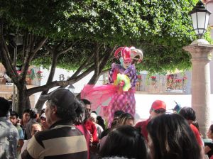Harlequin on stilts, Taxco, Mexico