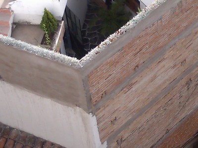Wall with broken glass on top, Taxco, Mexico