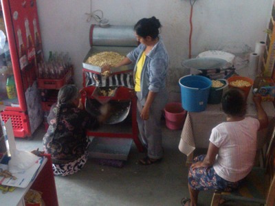 Grinding corn into masa, Teloloapan, Mexico