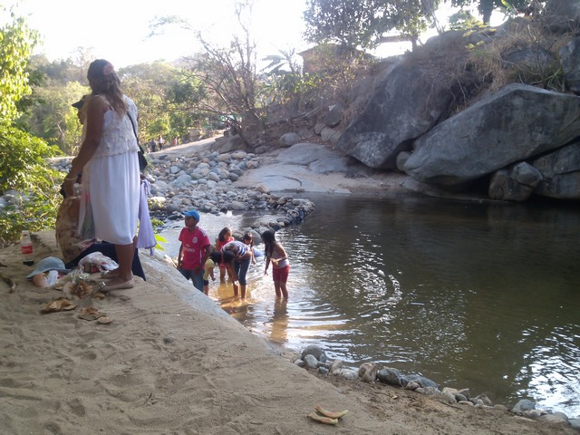 Playing in the river at the base of Tehaucalco, Mexico