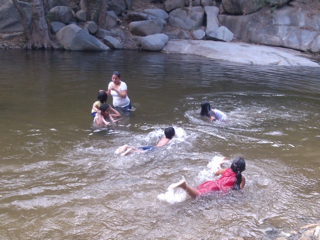 Playing in the river at the base of Tehaucalco, Mexico